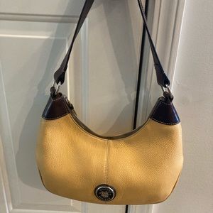 Dooney and Bourke mustard crescent shoulder bag.